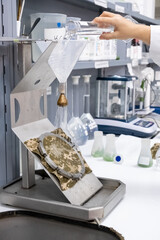 Waterproof test of a fabric in a textile factory or a research and development lab in close up view.