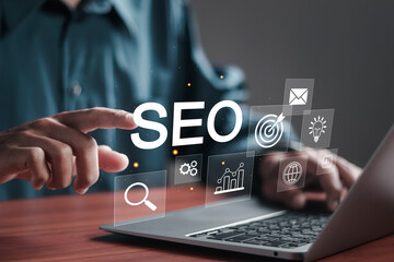 SEO search engine optimization concept, Businessman use SEO tools on laptop for promoting ranking...