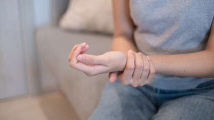 Woman female suffering from wrist sprain arthritis inflammation from physical injury problem