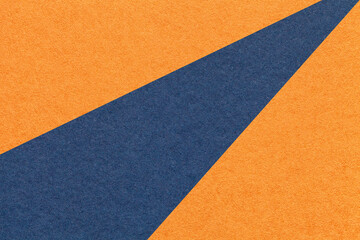 Texture old craft orange and navy blue paper background, macro. Structure vintage abstract ginger cardboard