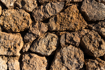 Ancient wall made of stones in the Egyptian desert, Sinai Peninsula. Background