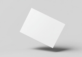 blank white card floating against light gray background, ideal for presentations or mockups. simplicity of design allows for versatile use in various projects