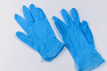 Disposable blue medical gloves on a white background. background, copy space.