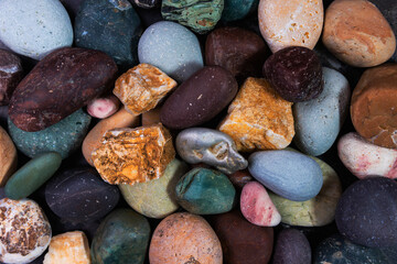 Sea pebbles, multicolored brown sea pebbles as a background. Background