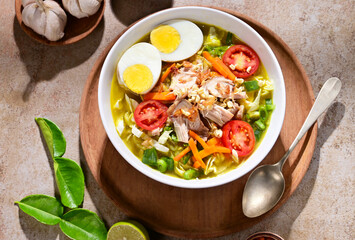 Soto ayam is a typical Indonesian food in the form of a kind of chicken soup with a yellowish...
