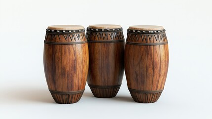 Three traditional wooden drums with intricate patterns on white background