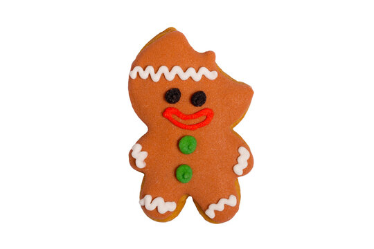 Homemade gingerbread colored cookie &bdquo; Bitten Christmas man&ldquo; on white, isolated Christmas handmade gingerbread cookie &bdquo;Bitten Christmas man&ldquo; on white background, Christmas dessert, top view, flat lay
