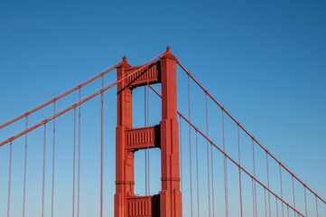 Closeup view of Golden Gate bridge with clear blue sky