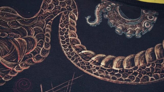 year of the snake 2025 painting clothes with acrylic paints and bleach on fabric using a tattoo machine