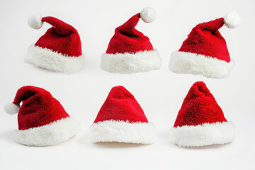 Festive red and white Santa hats displayed in various angles, perfect for holiday celebrations and Christmas spirit