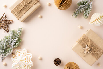 Top view of rustic Christmas gifts with natural decorations and pine branches. The warm tones and handcrafted elements create a cozy holiday atmosphere