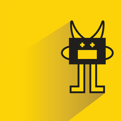 cute monster icon with shadow on yellow background