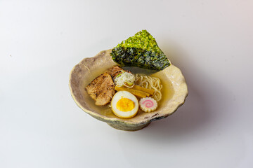 Asian noodle soup, ramen with chicken, tofu, vegetables and egg