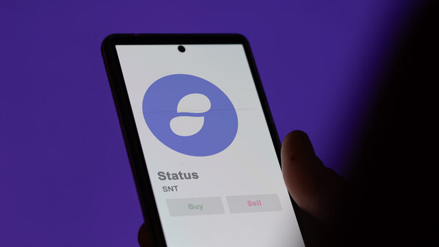 Close up on logo of SNT Status on the screen of an exchange. SNT Status price stocks, $SNT on a device.