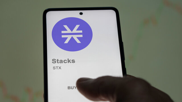 Close up on logo of STX Stacks on the screen of an exchange. STX Stacks price stocks, $STX on a device.