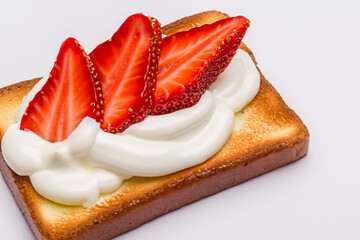 White sandwich with strawberries on . food sandwich snack concept. white plate with slices of toast, strawberries, and cream on a . a sandwich with strawberries, toasts, cream and a on slice of bread.