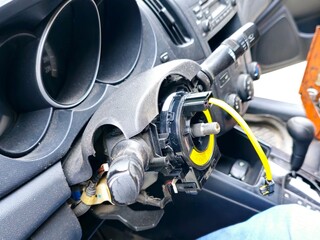 Maintenance of a car and replacement of airbag spiral cable clock spring, the cable stores energy on a rotating axis, a spiral-wound special rotary electrical conductor, the steering wheel is removed