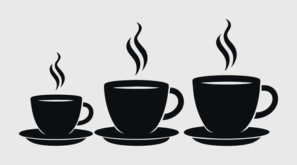 three steaming coffee cups in different sizes on saucers