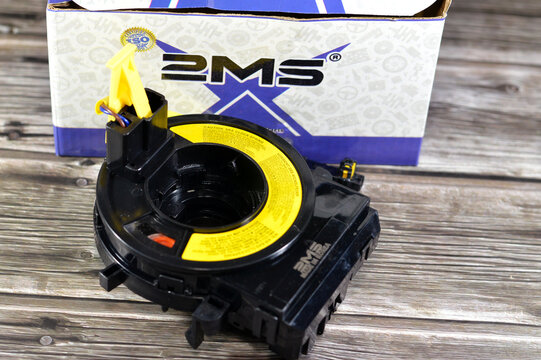 Cairo, Egypt, November 15 2024: BMS Airbag spiral cable clock spring for KIA Cerato car automobile, that stores energy on a rotating axis, consist of a flat multicore cable wound in a spiral shape