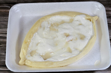 Honey labneh Chakhtoura, A sweet baked pastry of labna yoghurt pie, baked in the oven then covered with labanah yoghurt Middle Eastern staple and honey, shakhtoura dessert shakhtora, sweet pie