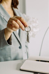 Close up of a person holding a key