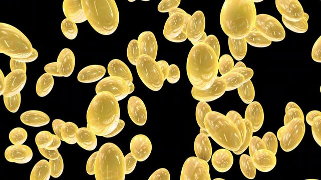 Close-Up View of Yellow Vitamin E and Fish Oil Capsules in Motion