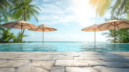 Serene beach view with umbrellas and palm trees surrounding a tranquil pool.