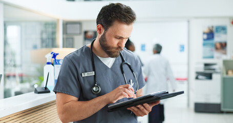 Tablet, man and doctor in hospital with telehealth, medical research or feedback on website. Digital technology, reading and male healthcare worker with online surgery or treatment plan in clinic.