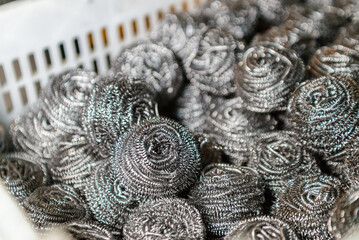 Metal cookware scraper on a white background. Universal metal scraper.