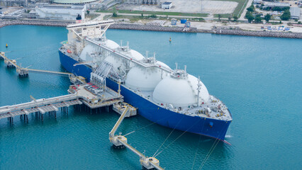 LNG (Liquified Natural Gas) tanker anchored in Gas terminal gas tanks for storage. Oil Crude Gas...