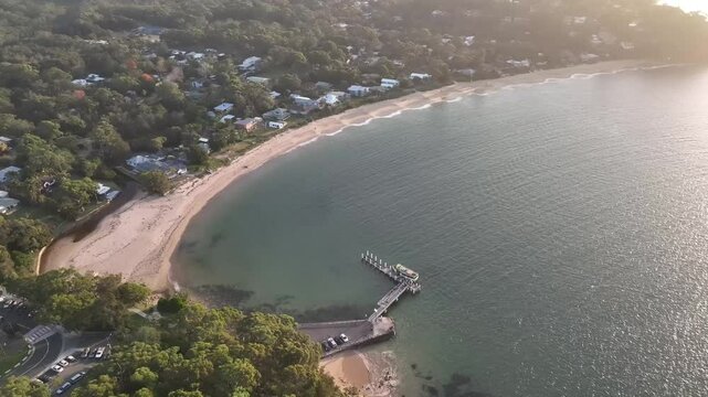 Simpsons Bay aerial drone footage over moored boats and calm water, Bundeena, Royal National Park, NSW Australia