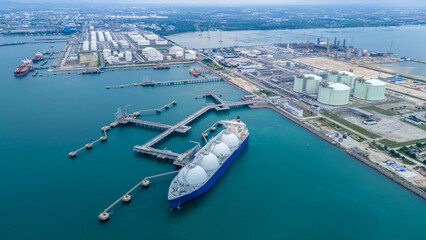 LNG (Liquified Natural Gas) tanker anchored in Gas terminal gas tanks for storage. Oil Crude Gas...