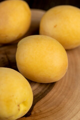 ripe soft apricot fruits on the cutting board