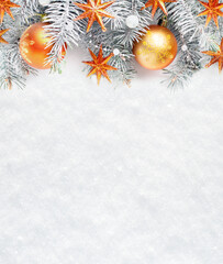  Christmas tree branches with  decorations on the background of natural snow with empty space for...