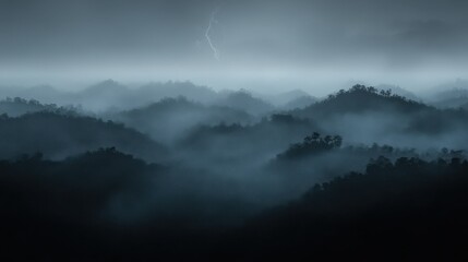 Dramatic lightning storm over misty, mountainous landscape.