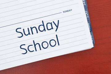 Sunday School on day planner on desk