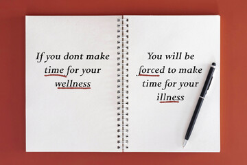 Open blank notepad on maroon background, flat lay, with message If you dont make time for your wellness you will be forced to make time for your illness. Healthcare and mental care concept