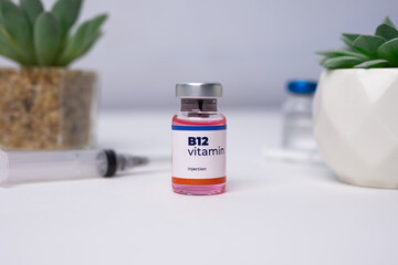 a close up of B12 Vitamin liquid sits on the white table