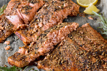 baked salmon fillet on baking tray, top view