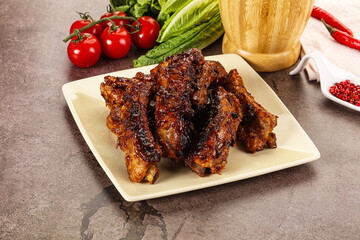 Grilled pork ribs in barbecue sauce