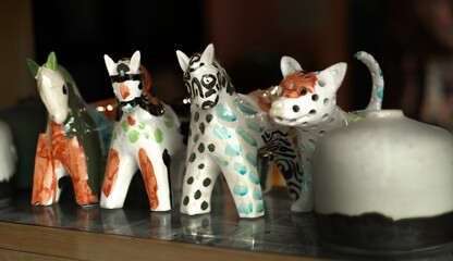 Ceramic animal figurines on glass