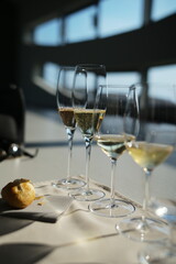 A selection of champagne flutes filled with kreinbacher sparkling wine 