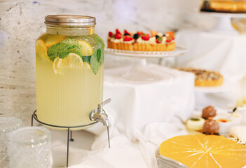 Lemon lemonade, large jar with a tap, summer drinks, sweet lemonade, drink for children, sweet...