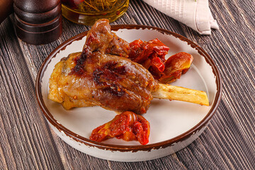 Baked lamb shank with vegetables