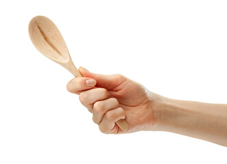 Wooden spoon in female hand