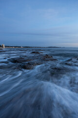 Cloudy morning view at the rocky shore.