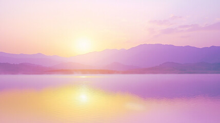 Fototapeta premium Silhouette of mountains reflecting on a still lake at sunset.