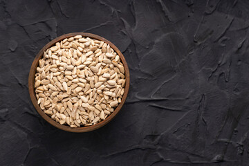 Helianthus annuus - Shelled sunflower seeds in bowl.