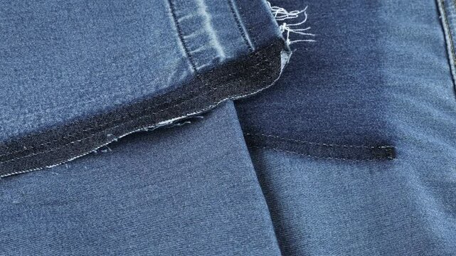 soft folds of blue denim of a muted shade fabric rotate
