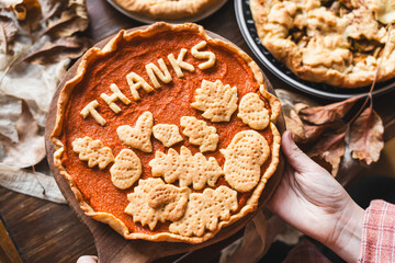 preparation process of Thanksgiving Pumpkin pie with autumn leaves decor